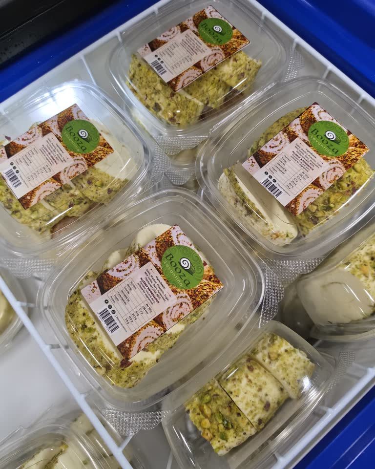 Sealed retail-ready tubs of Booza Levantina with printed ingredient labels.
