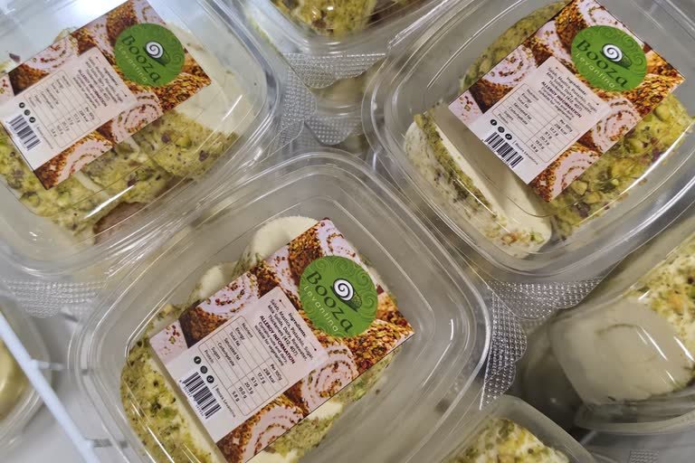 Retail-ready tubs of Booza Levantina stacked in a chilled display crate.